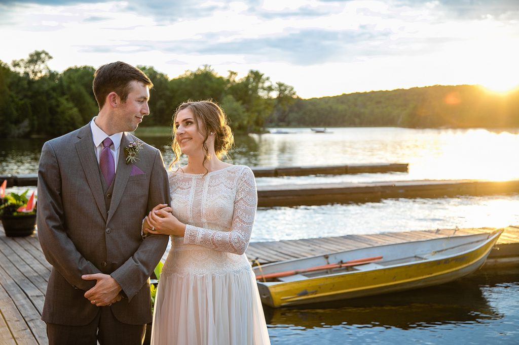 Haliburton destination wedding sunset by the lake with boats in the background