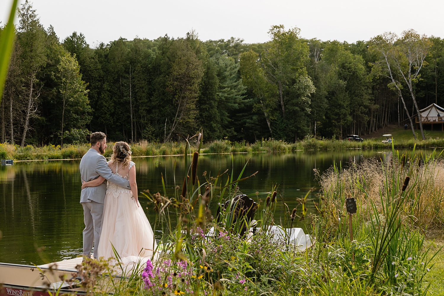 wedding photo by the pond at whispering springs