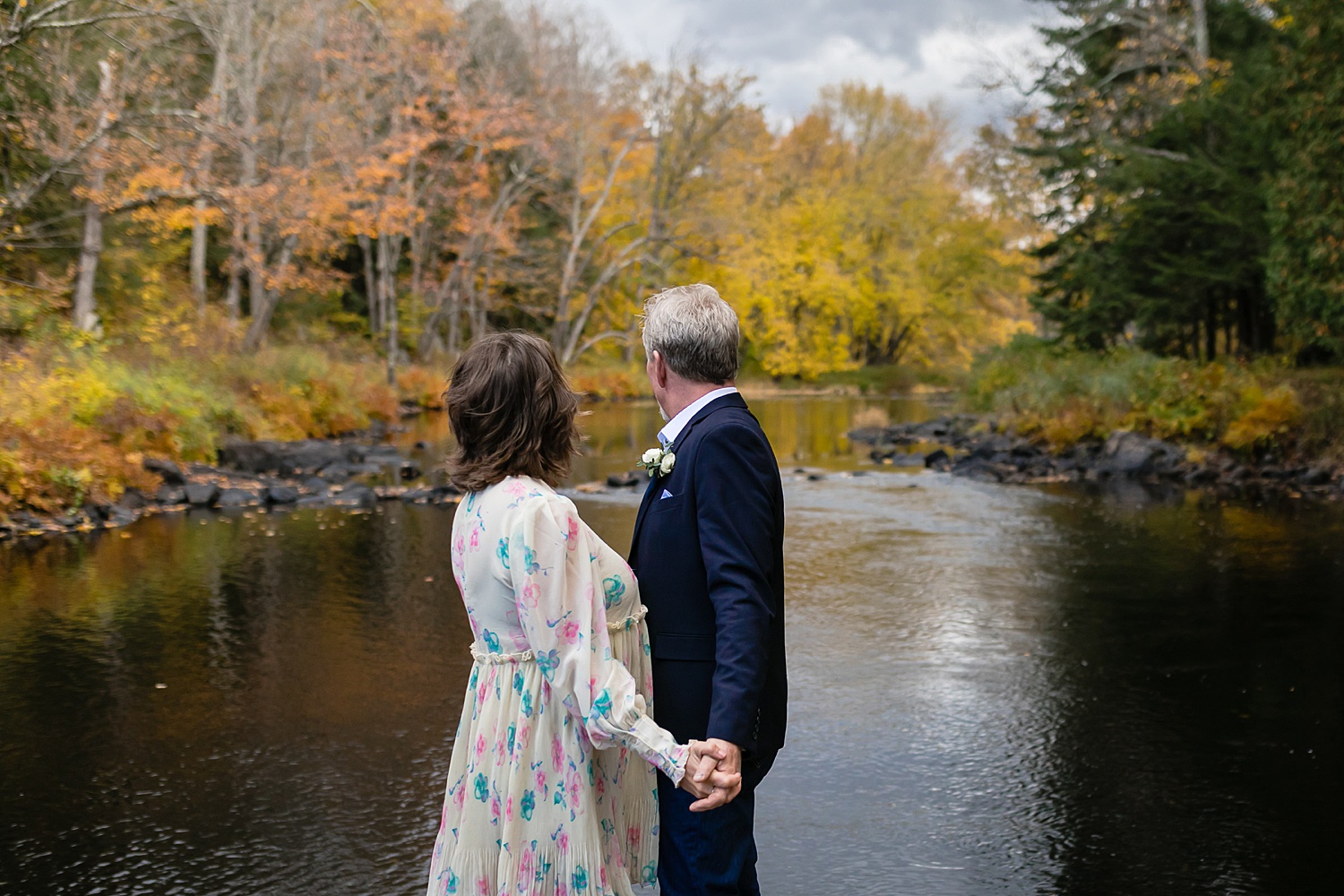 couple looking over Black River